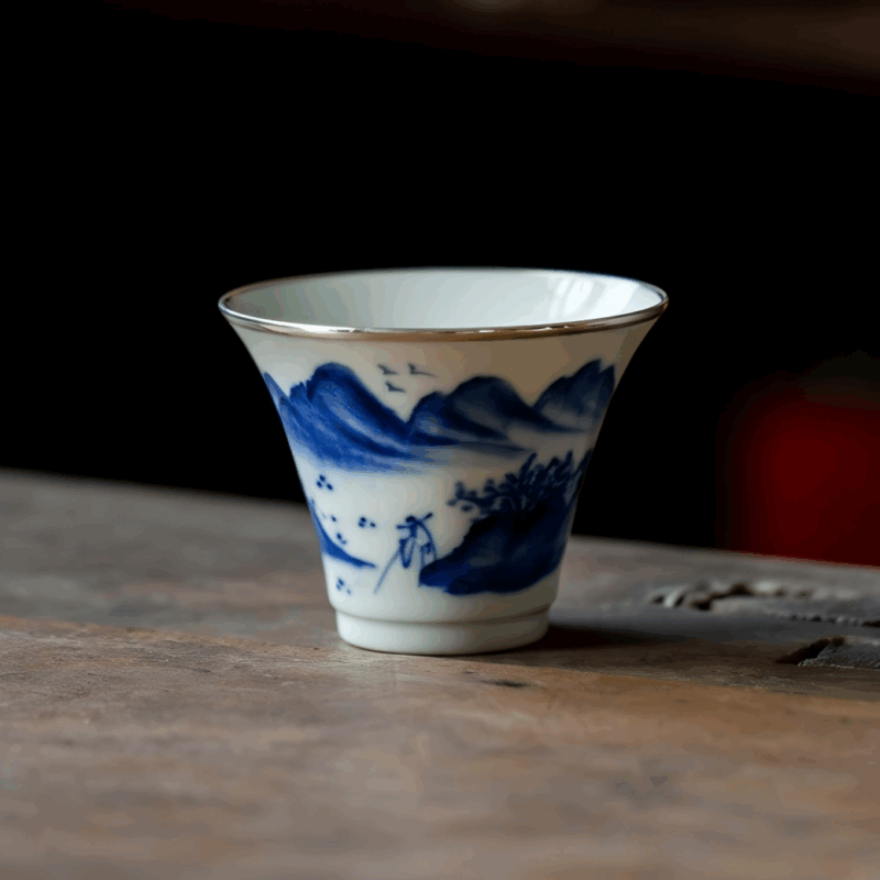 Hand-Painted Blue & White Porcelain Teacup with Silver Trim