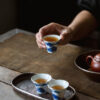 Hand-Painted Blue & White Porcelain Teacup with Silver Trim