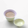 96bd039c33c84c235afa06949bd6394f Pouring tea from 90ml dual-color gaiwan (yellow exterior, pink-purple interior) into 45ml cup