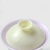 bc18d077e6bc50e3785654e91d074177 Close-up of dual-tone gaiwan lid and bowl – yellow exterior, pink-purple inner glaze