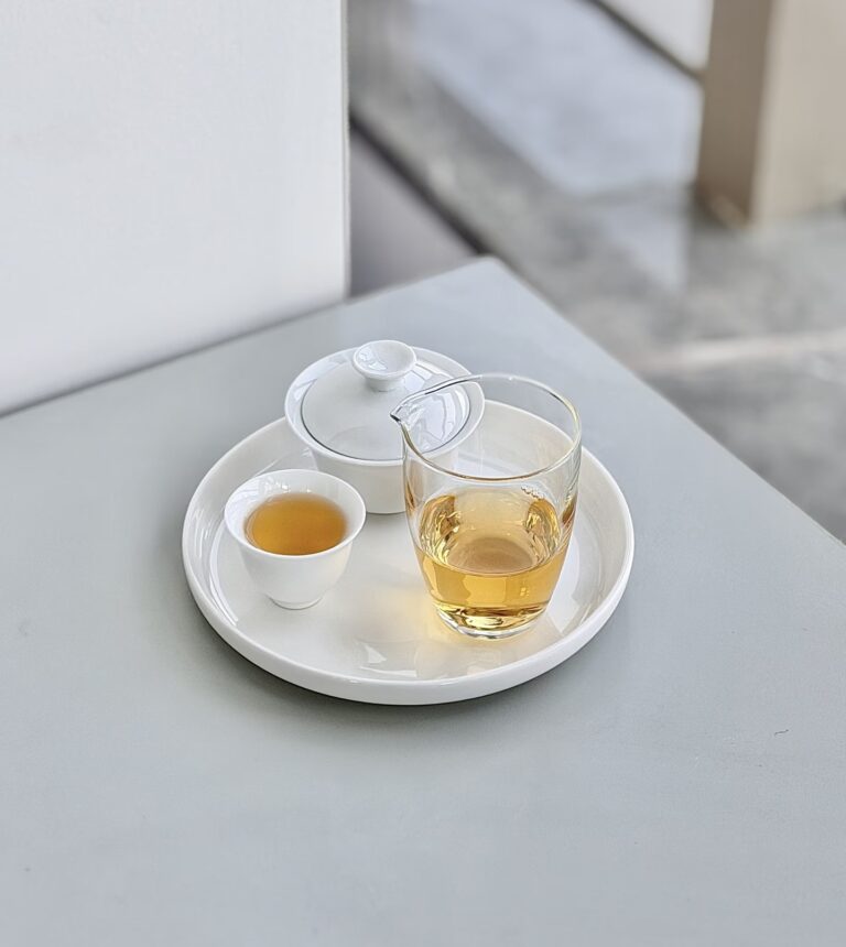 Minimal gongfu tea setup with gaiwan and small Chinese tea cups