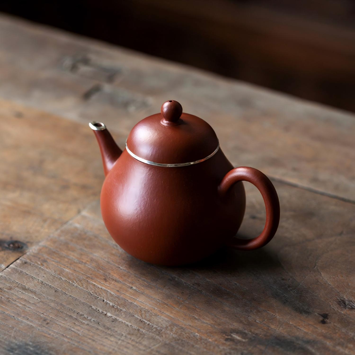 Handcrafted Yixing Zisha Clay Teapot with Sterling Silver Trim