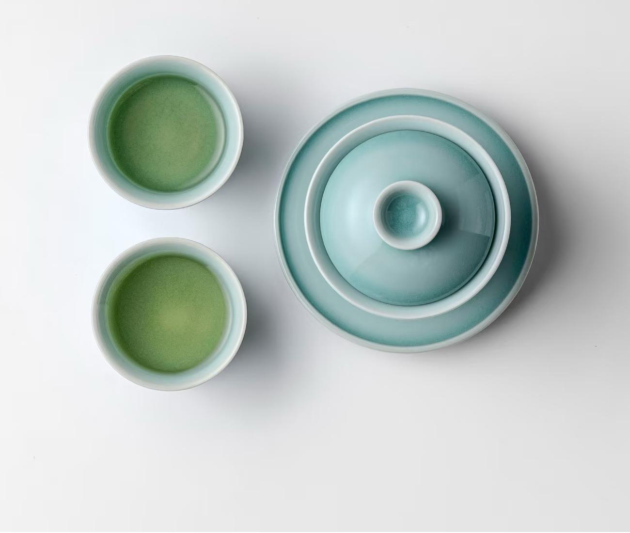 a2e4706b1d8b2f9658bbbe53aba60488 Close-up of horseshoe cup rim and powder blue glaze texture