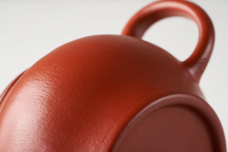 A classic red Yixing Zisha teapot often categorized as Da Hong Pao clay in the modern market.